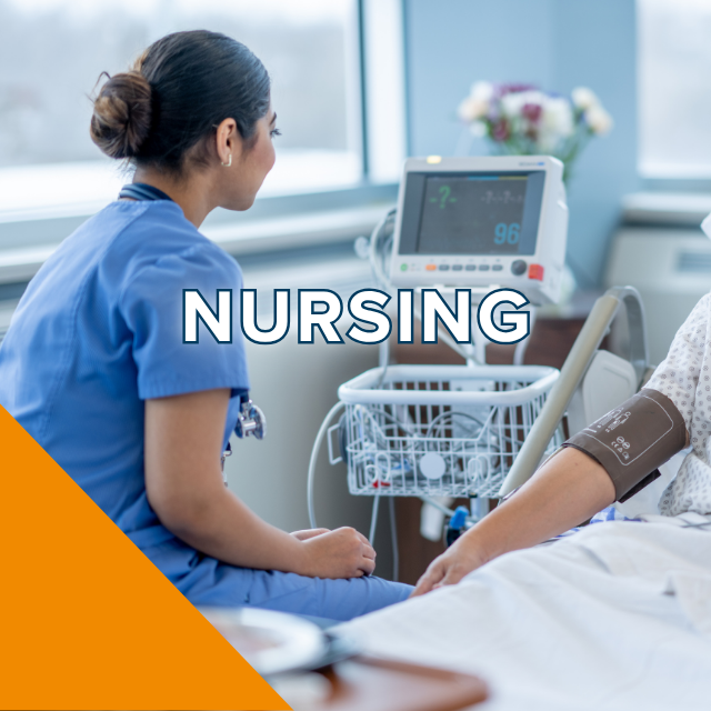 Nurse in blue scrubs checking a patient's blood pressure at bedside, photo.