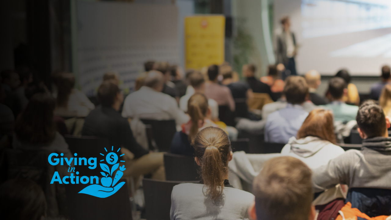 Blurry conference audience seated facing speaker on stage; 'Giving Advice' logo