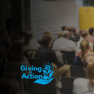 Blurry conference audience seated facing speaker on stage; 'Giving Advice' logo