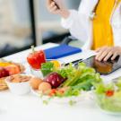 bowls of fruits and vegetables with a dietitian 